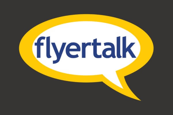 Logo with the word "flyertalk" in blue inside a yellow speech bubble on a dark background.